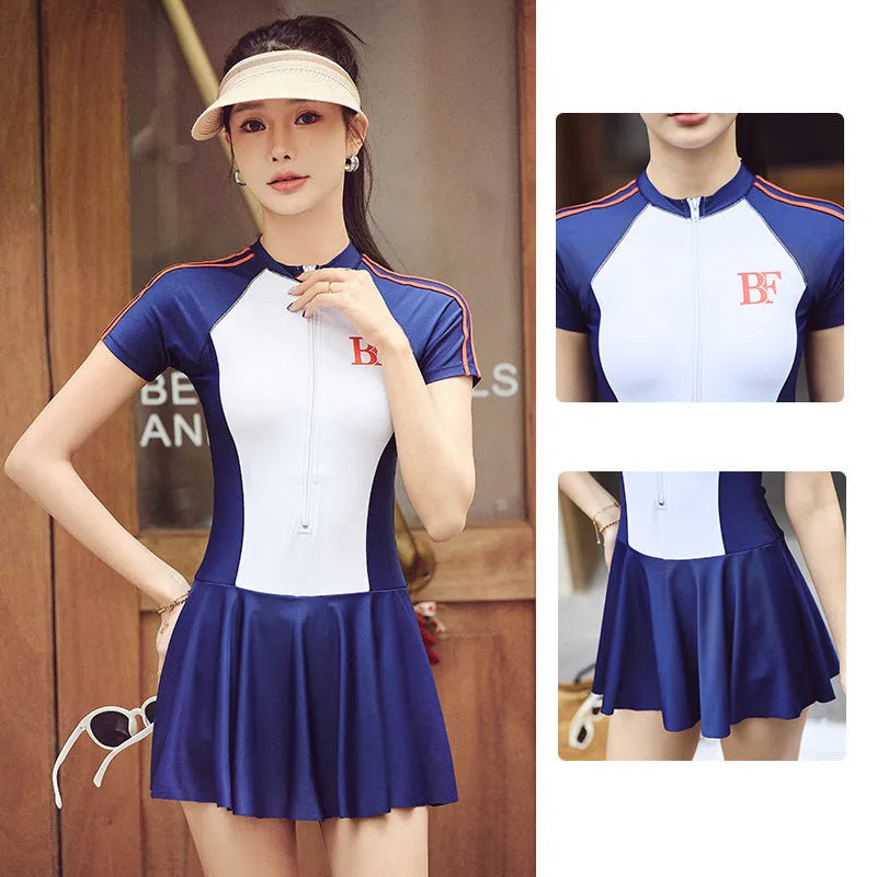 Ladies conservative sports one-piece swimsuit in a colour-matching pattern, shown on a model.