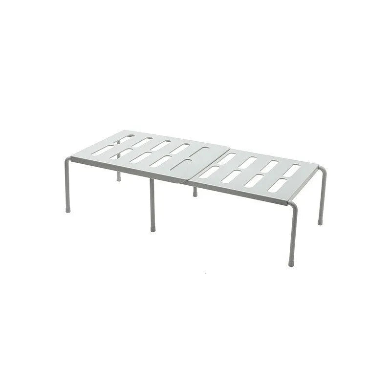 White telescopic kitchen rack with adjustable height showing extended and compressed positions
