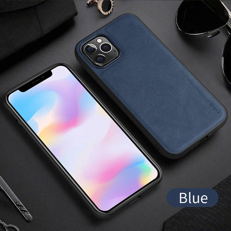 Black PU leather iPhone 12 phone case with soft TPU sides on a wooden table.