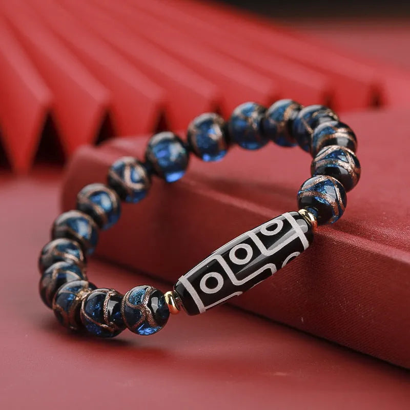 Chinese-style five-colour lucky snake bead bracelet made from coloured glaze, showing auspicious patterns.
