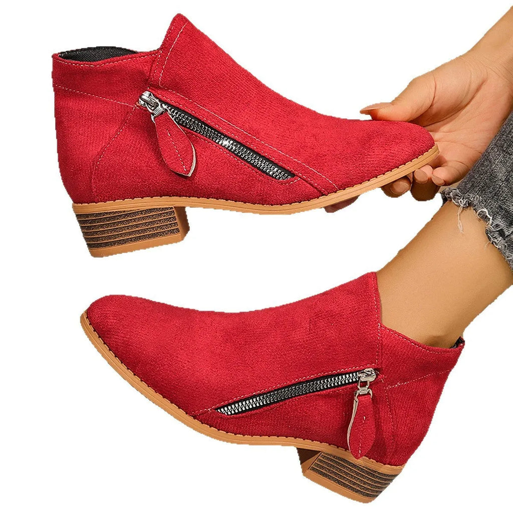 Suede women's ankle boots with side zipper in beige, shown on a white background