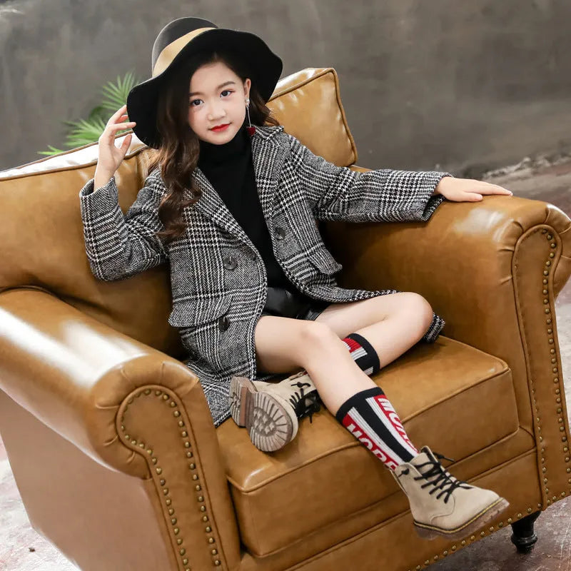 Girls grey and white houndstooth plaid coat with suit collar and long sleeves.