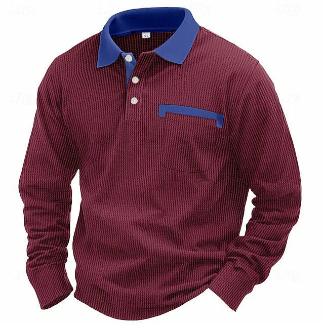 Man wearing a dark green waffle-knit long-sleeved polo shirt with an asymmetric design detail.