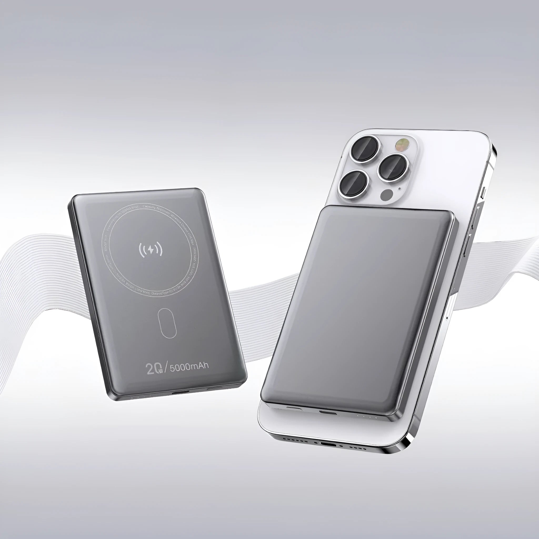 Magnetic wireless power bank with alloy shell in black, compact portable charger on a plain background