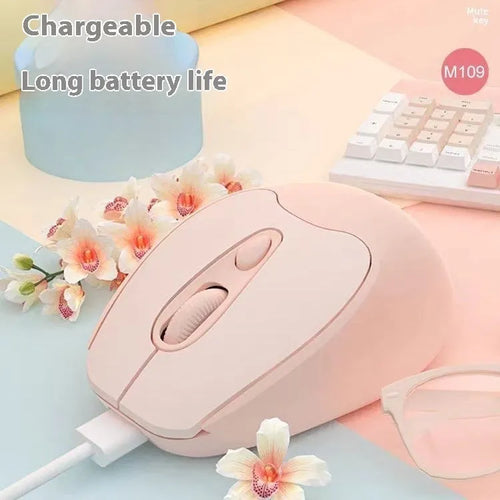 Bluetooth wireless mouse in choice of girl pink, milk tea pink, grey or green colours on a desk next to a laptop.