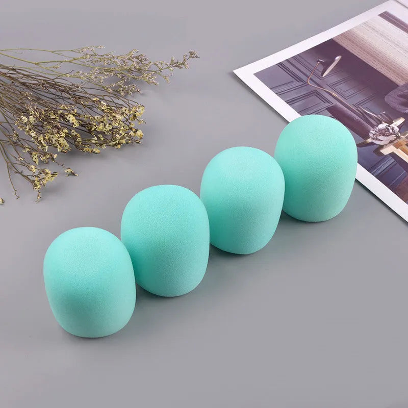 Four multicoloured foam microphone windshields for ball-shaped handheld stage microphones