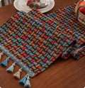 Country European retro cotton blend table flag with handwoven tassels on sideboard
