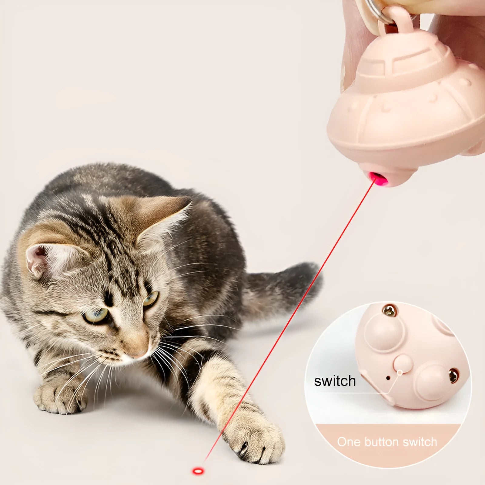 Green automatic cat laser toy attached to pet collar with USB charging port visible
