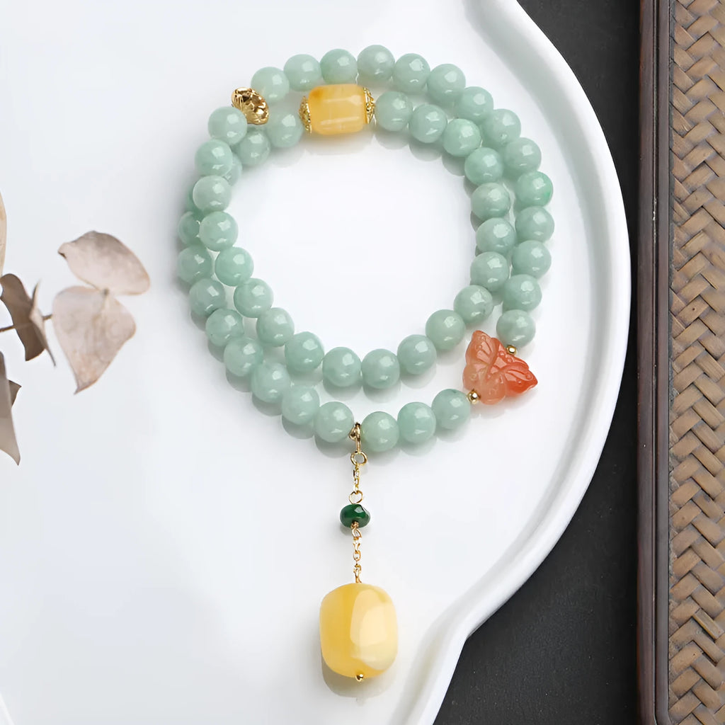 Close-up of a double-layer women's bracelet with jade round beads and beeswax barrel beads in a retro geometric design
