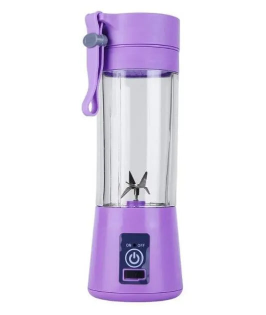 Pink mini USB electric fruit juicer with carrying rope on a kitchen countertop.