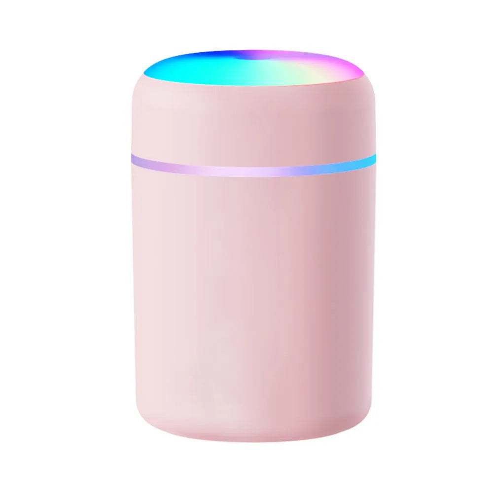 Mini horse USB humidifier aroma diffuser with transparent tank, black cover, and single fog nozzle on desk