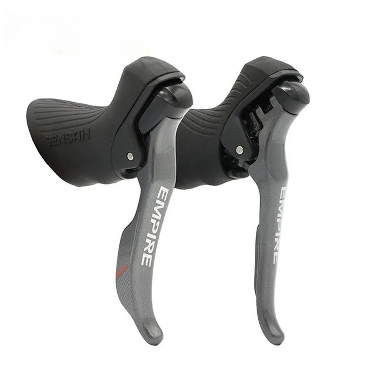 Aluminium road bike transmission kit showing hand change dial, front dial, short leg rear derailleur, chain, and decorative beads.