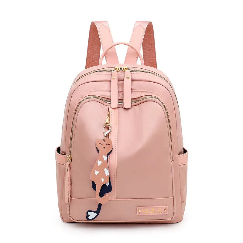 Black nylon casual backpack with square vertical shape, soft handle, and three-dimensional outer pocket