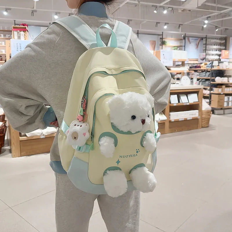 Nylon school backpack in macaron colours with curved shoulder straps and 20-35L capacity