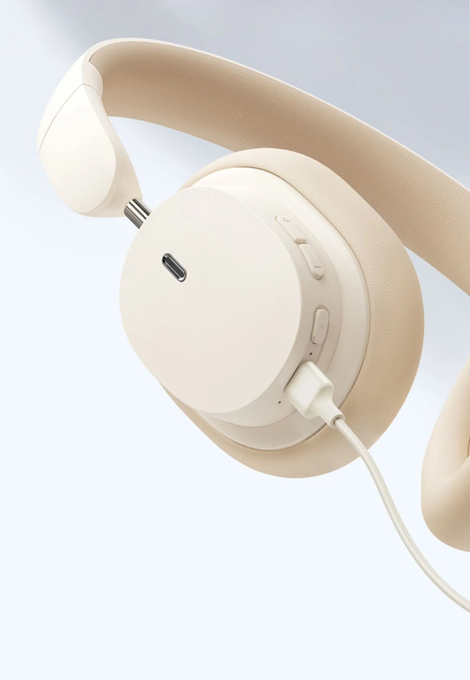 Beige or grey Bluetooth head-mounted earphones with Type-C charging port