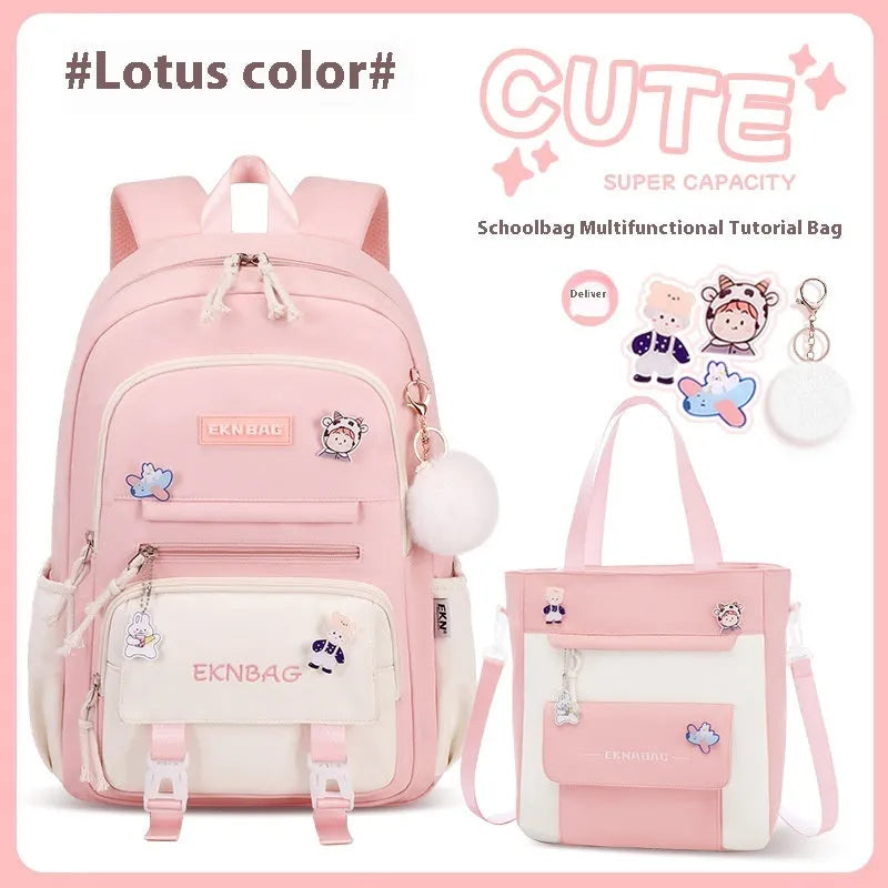 Girls' pink waterproof Oxford cloth school backpack with curved shoulder straps.