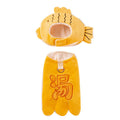 Yellow onsen fish pet costume with fish-shaped hat and vest on a dog with leash ring