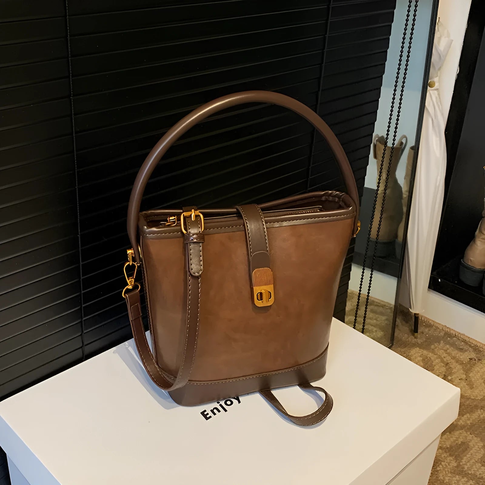 Women's PU handbag in simple style available in black, brown, and coffee colours in large and small sizes