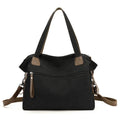 Large khaki retro canvas shoulder bag for women showing external sandwich pocket and internal organiser compartments.
