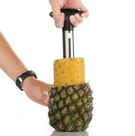 Stainless steel pineapple corer slicer with ABS handle on a kitchen worktop