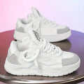 Men's white clunky casual sneakers with cartoon totem pattern, round toe, and lace-up front on a rubber sole.
