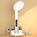 LED clock table lamp with USB rechargeable battery, fan attachment, and digital display on a desk