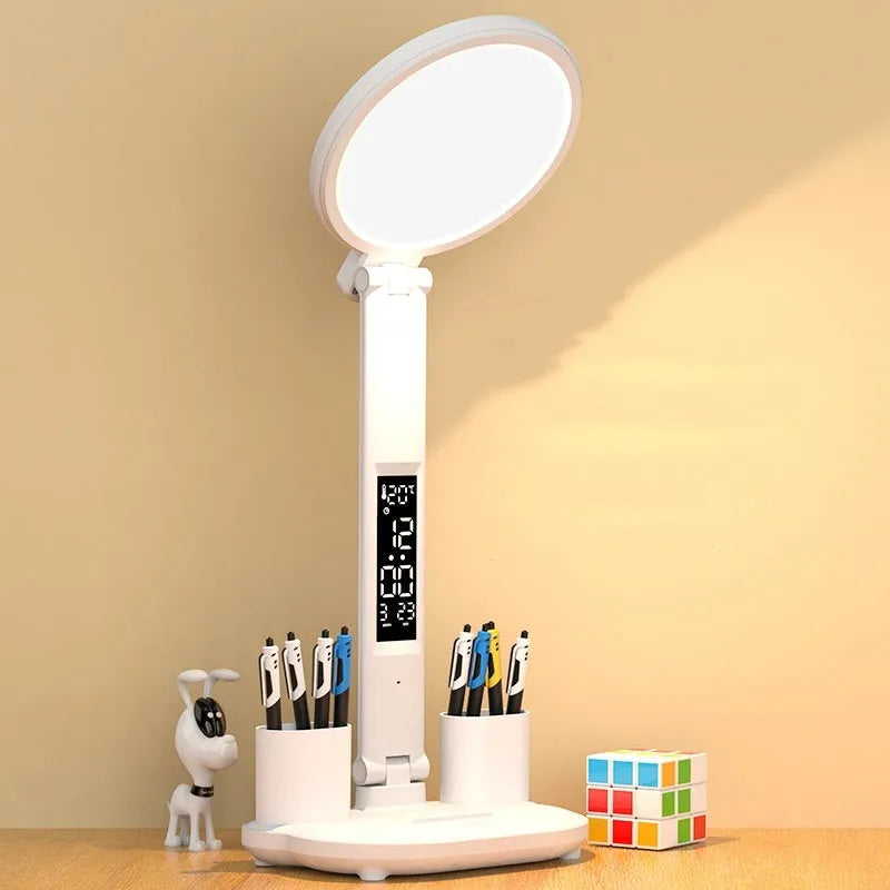LED clock table lamp with USB rechargeable battery, fan attachment, and digital display on a desk