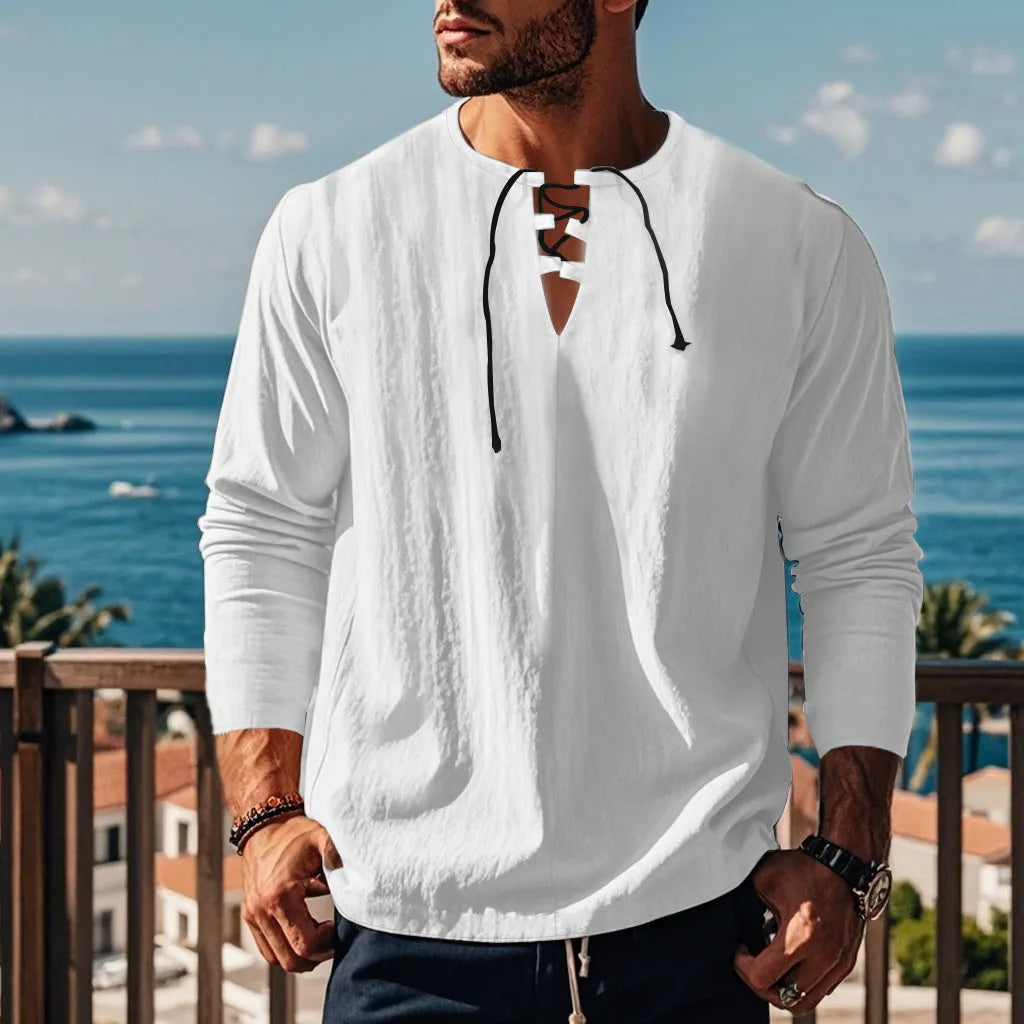 Man wearing a loose fit solid colour cotton linen beach shirt in a casual setting.