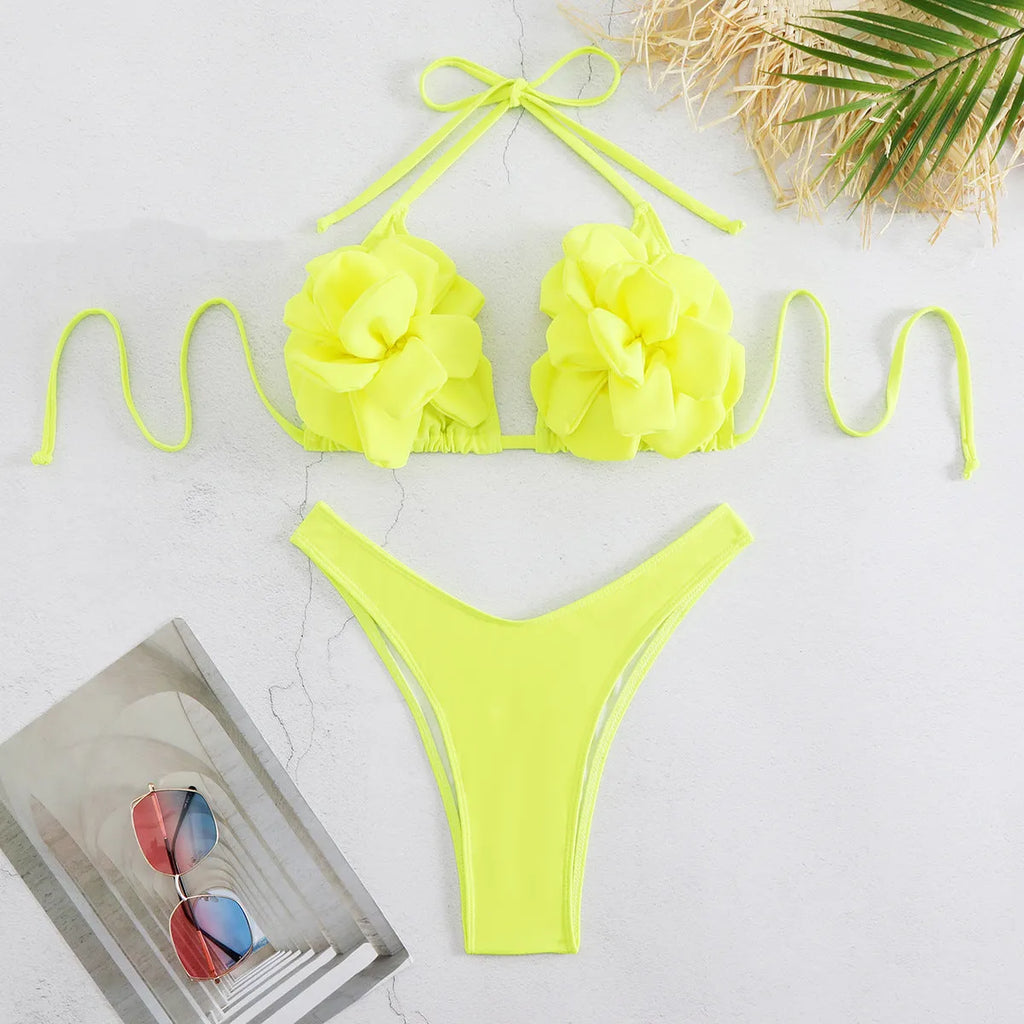 Women's low waist bikini swimsuit with 3D flower design in solid colour