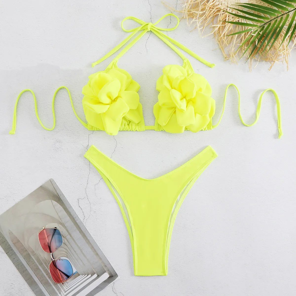 Women's low waist bikini swimsuit with 3D flower design in solid colour