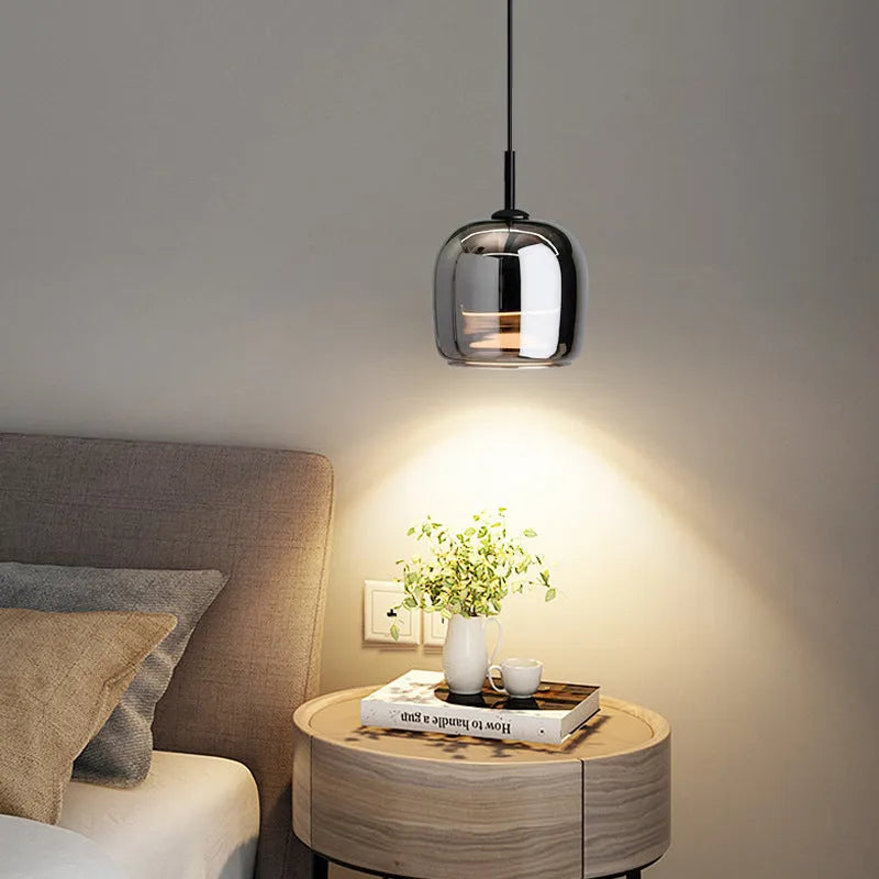 Italian minimalist glass chandelier with tricolor light in a dining room setting