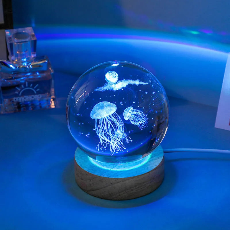 Colorful luminous crystal ball on light wooden base with data cable