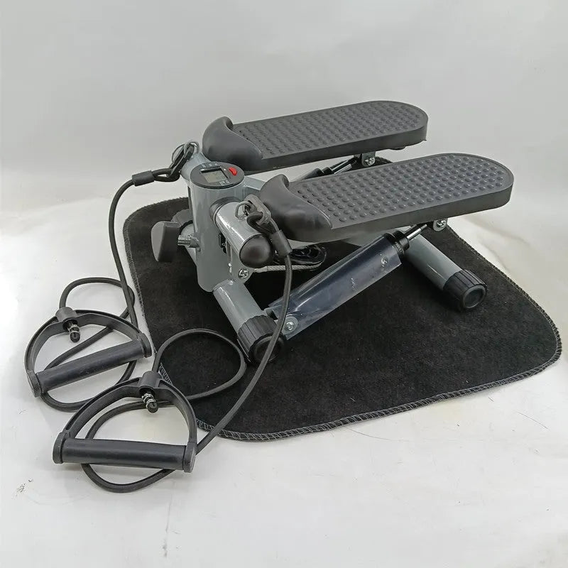 Silver grey hydraulic mini treadmill for waist slimming and home workouts.