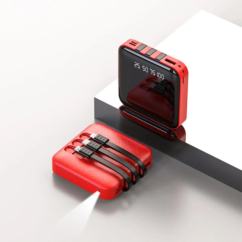 Black and red portable power bank with built-in charging cable, showing compact size.