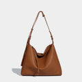 Soft PU leather messenger bag in caramel colour showing large capacity and shoulder strap.