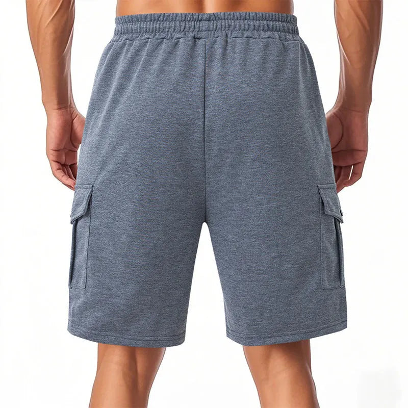 Heavy terry fabric cargo sports shorts with multiple pockets in light grey colour showing loose fit design
