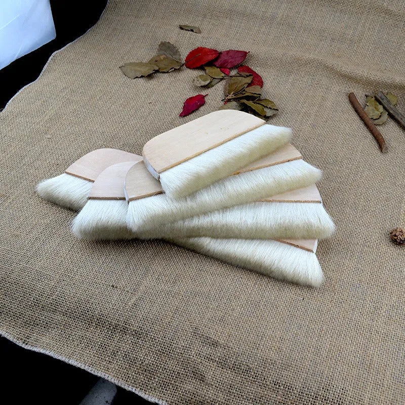 Natural wool brush for art mounting and shading craft projects in four size options.
