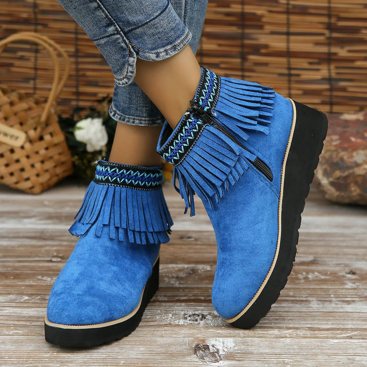 Women's suede wedge ankle boots with side zipper, thick rubber sole, and tassel detailing in dark brown colour