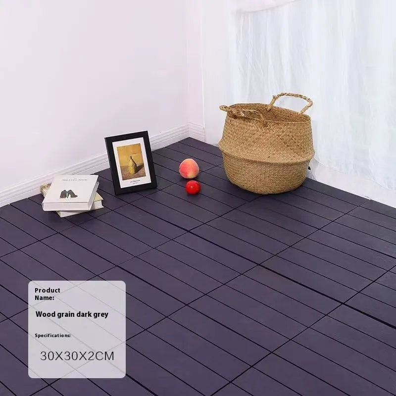 Ten wood grain plastic floor tiles stacked, showing dark grey and light grey colour options with non-slip texture.