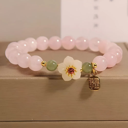 Crystal Hetian jade beaded bracelet with peach blossom design and camellia fruit elements