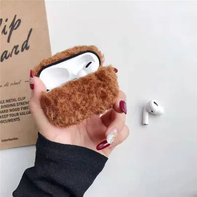 Green plush plastic headphone cover for Apple AirPods showing creative design elements