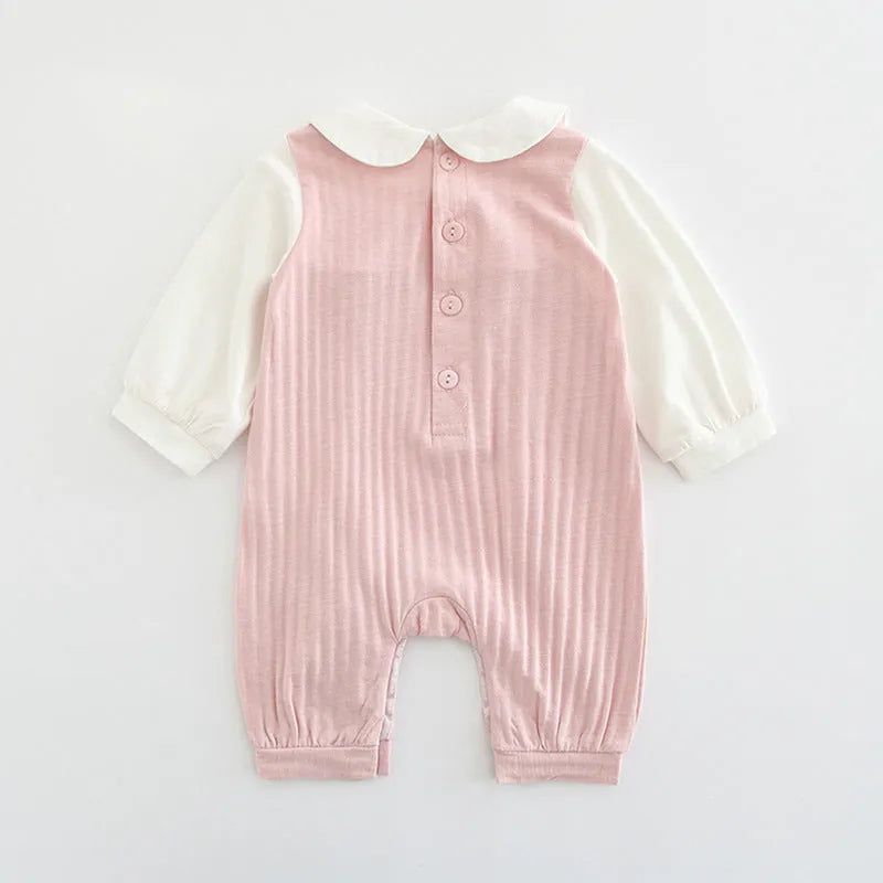 Pink long sleeve cotton baby jumpsuit with single-breasted front closure for a girl.