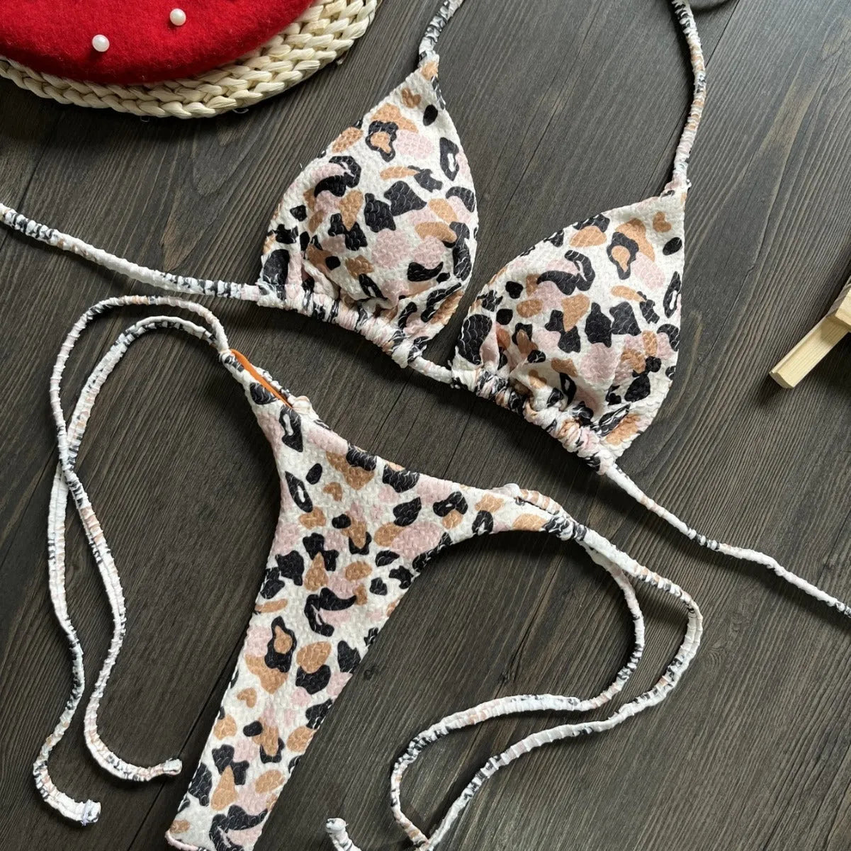 Women's printed nylon bikini with briefs style and cotton lining for swimming sports.