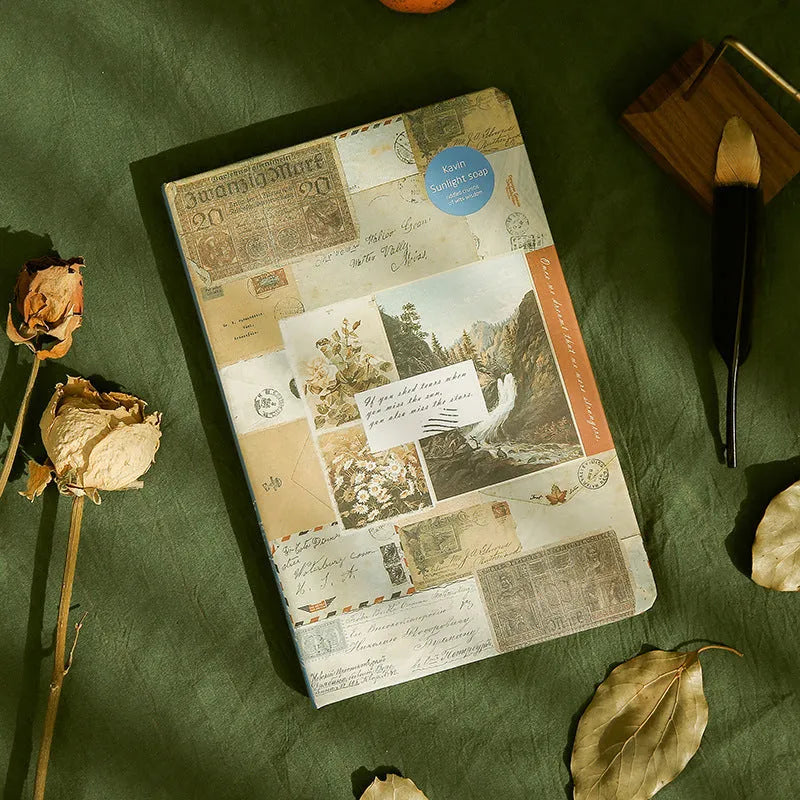A5 kraft paper mood notebook open on a page, showing its European retro style and colour options of blue, coffee, and red.