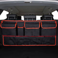 Black waterproof Oxford cloth car boot hanging storage bag with carry handle.