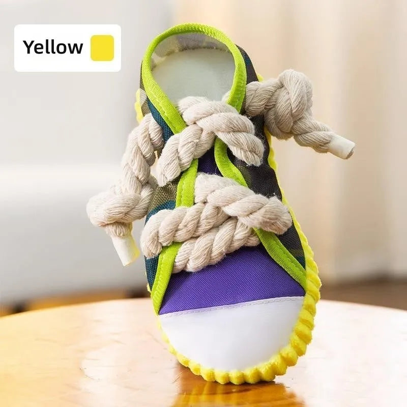 Dog toy shaped like cotton rope slippers with shoelaces, sole patterns, and built-in sound devices for playtime