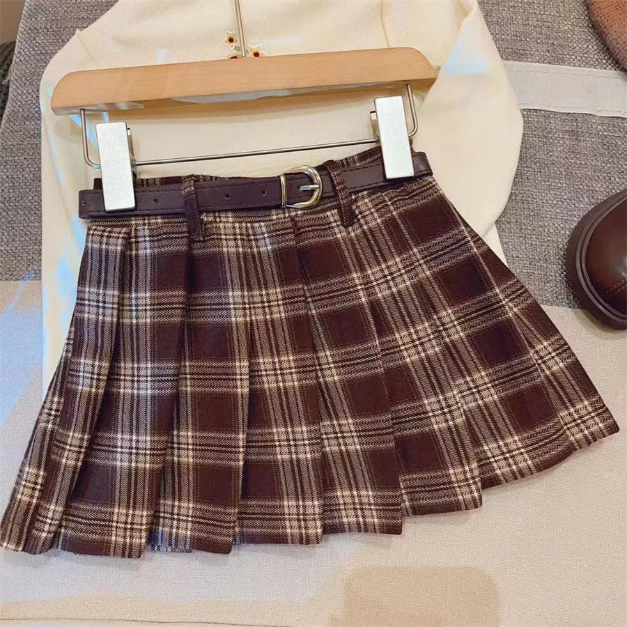 Girls' plaid pleated skirt in cotton blend fabric showing A-line silhouette