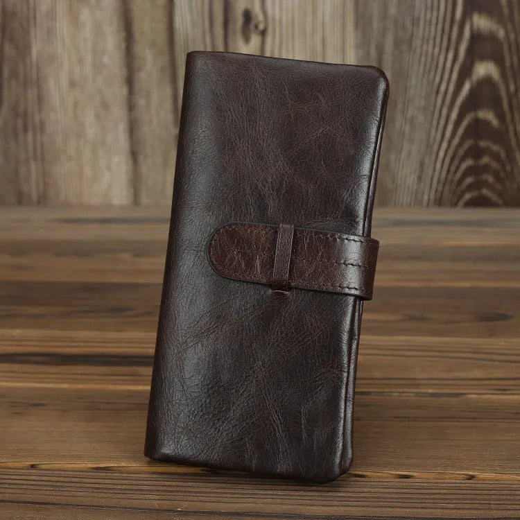 Genuine leather women's wallet in black showing vertical style with multiple card slots