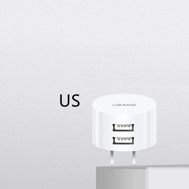 White portable universal dual USB phone charger showing US, EU and UK plug compatibility