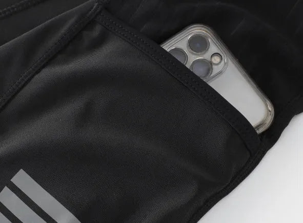 Black seven-inch cycling shorts with a shock-absorbing strap and double pockets, shown with an included cycling cushion.